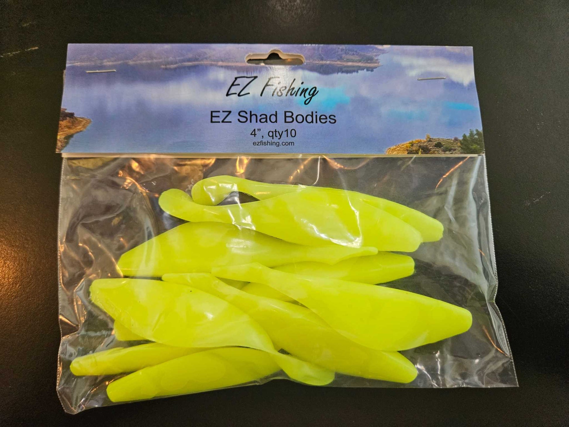 A package of 10 EZ Fishing, Silk Chartruese Shad Bodies