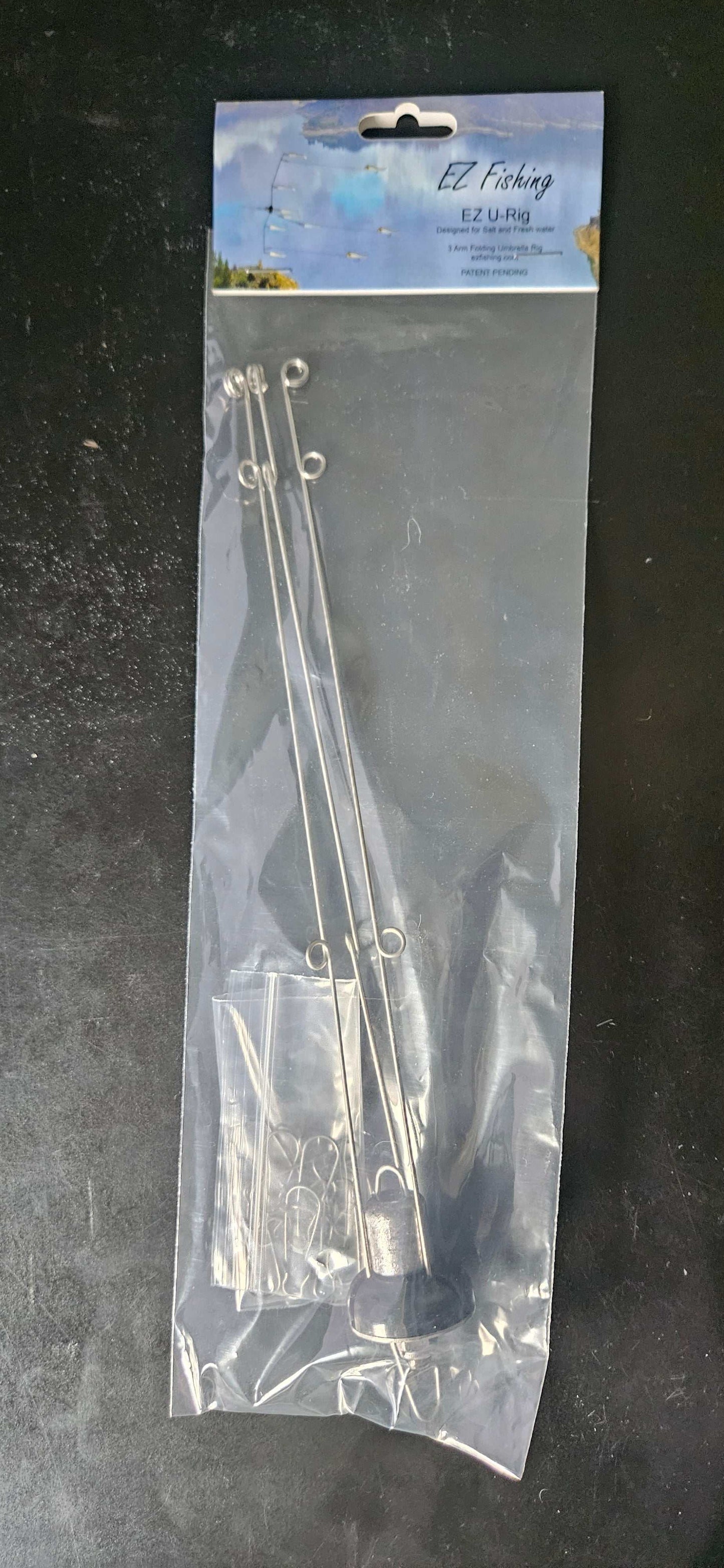 An image of a EZ U-Rig, 3 arm folding umbrella rig in the package